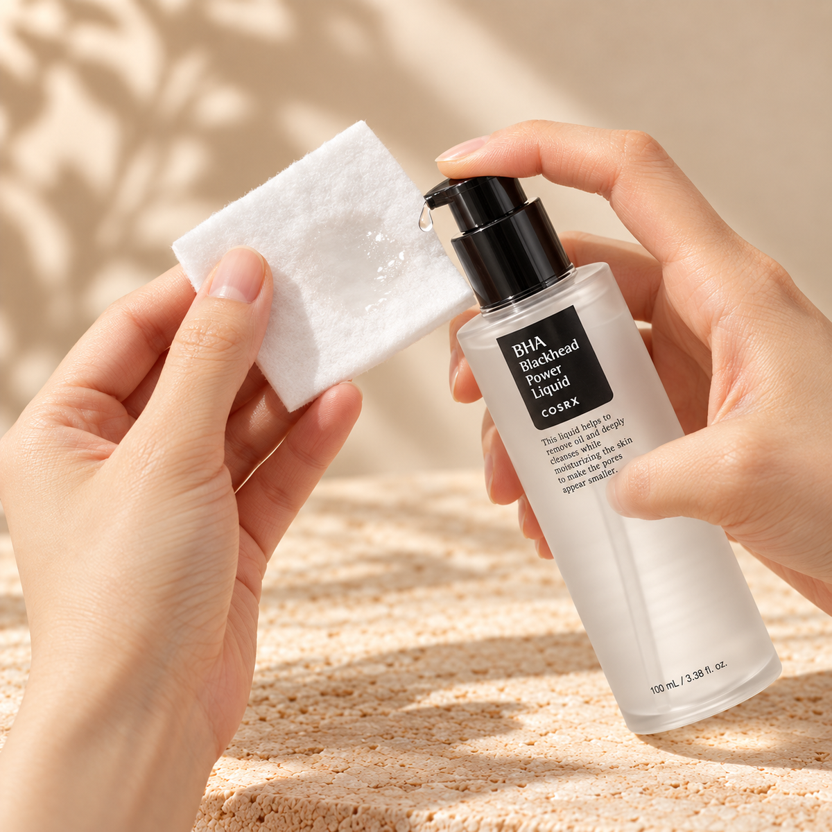 COSRX BHA Blackhead Power Liquid 100ml application onto a cotton pad